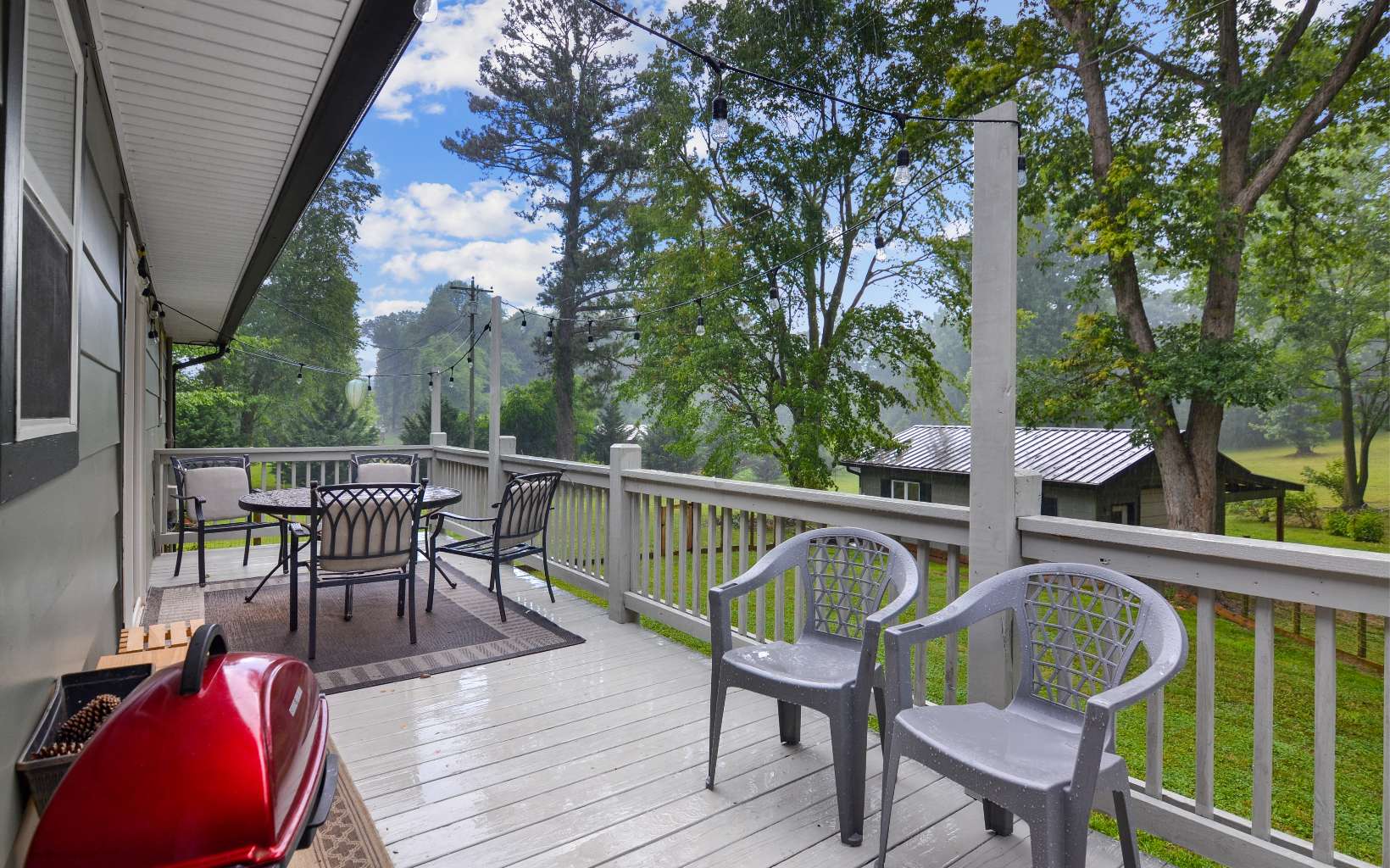 483 Parker Road Ellijay, GA 30536 - Photo 24 of 33 a view of a chairs and table on the deck