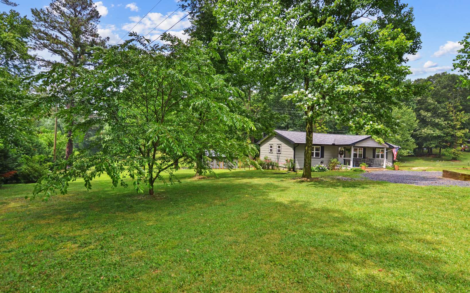 483 Parker Road Ellijay, GA 30536 - Photo 28 of 33 a front view of a house with a garden