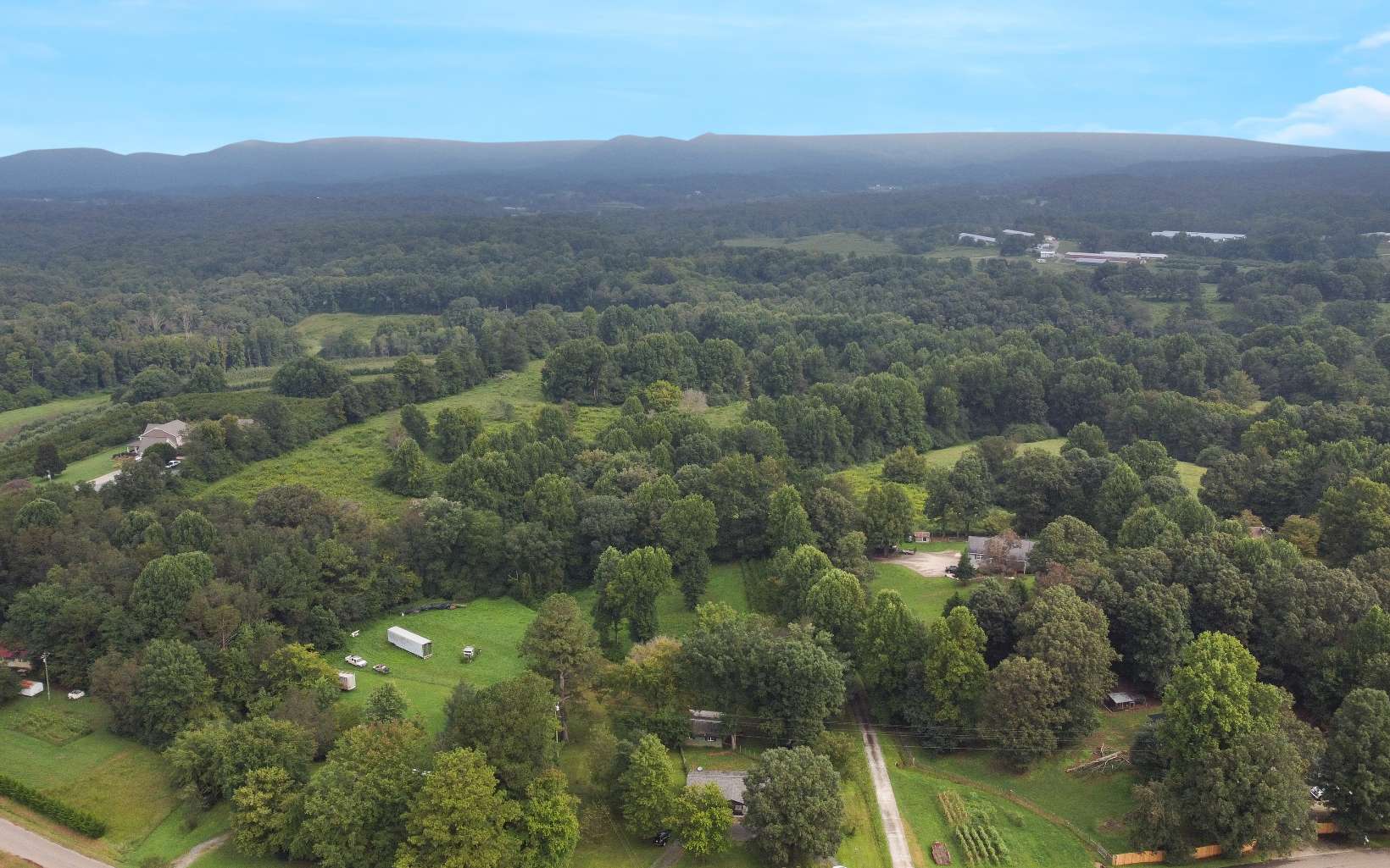 483 Parker Road Ellijay, GA 30536 - Photo 30 of 33 an aerial view of residential houses with outdoor space and trees