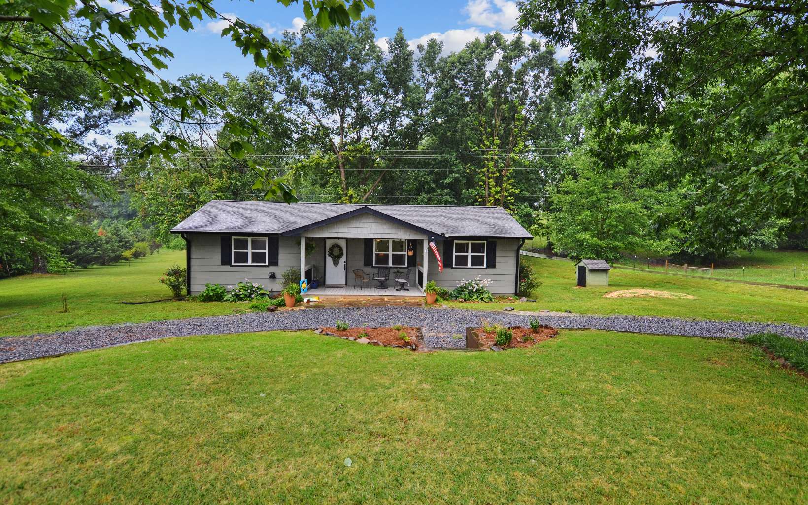 483 Parker Road Ellijay, GA 30536 - Photo 32 of 33 a front view of a house with garden