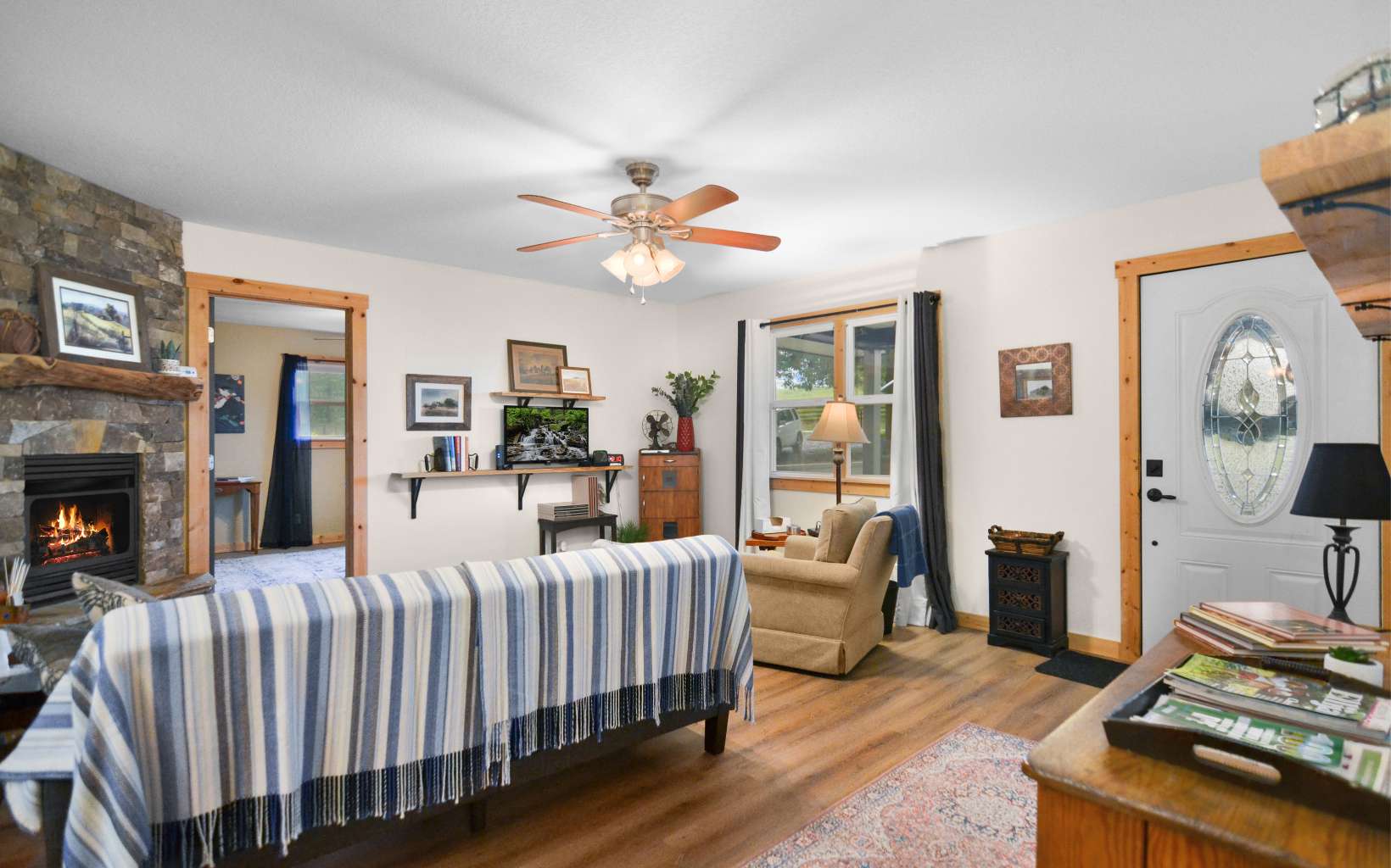 483 Parker Road Ellijay, GA 30536 - Photo 5 of 33 a bedroom with furniture and a fireplace