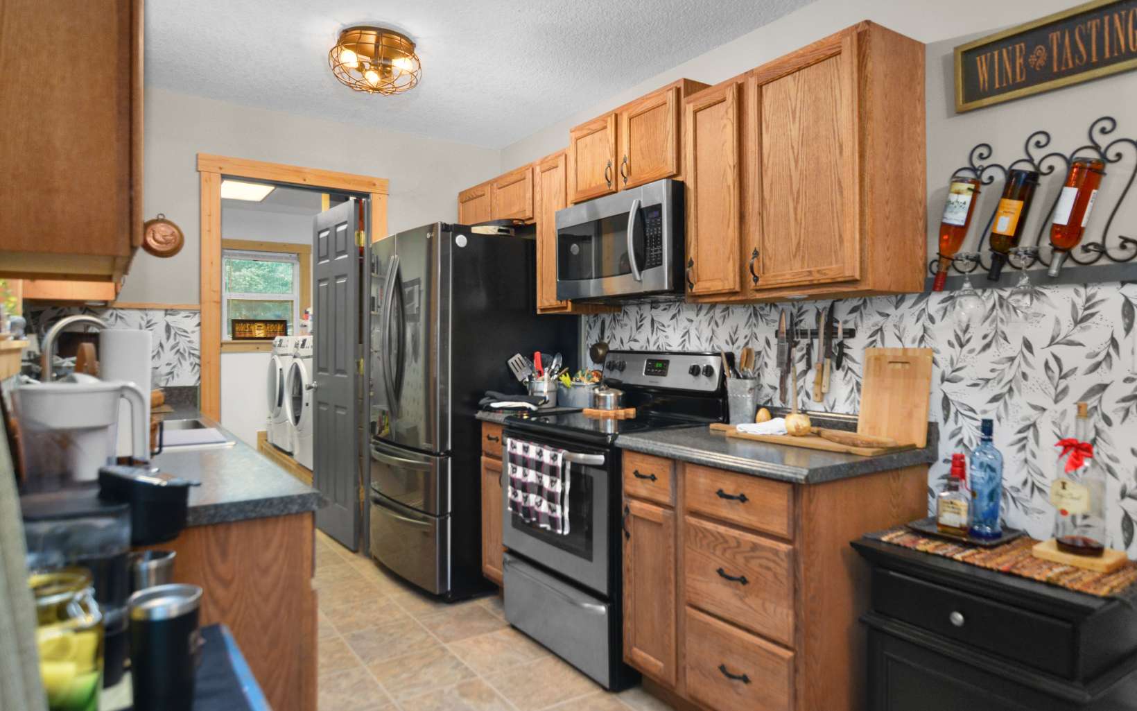 483 Parker Road Ellijay, GA 30536 - Photo 7 of 33 a kitchen with stainless steel appliances granite countertop a sink stove and refrigerator