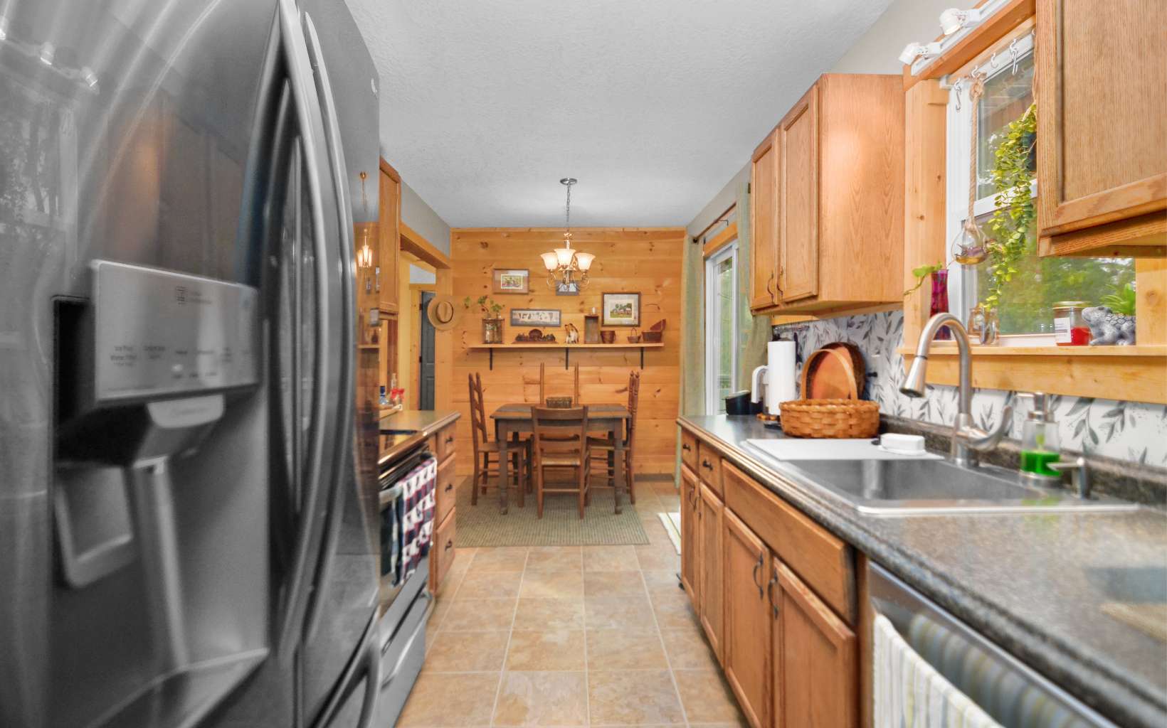 483 Parker Road Ellijay, GA 30536 - Photo 9 of 33 a kitchen with granite countertop a sink and a refrigerator