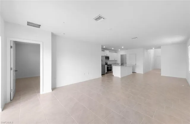 a view of a kitchen with a sink and cabinets