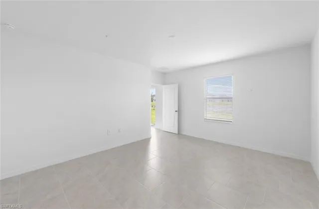a spacious bathroom with a granite countertop sink a toilet and shower