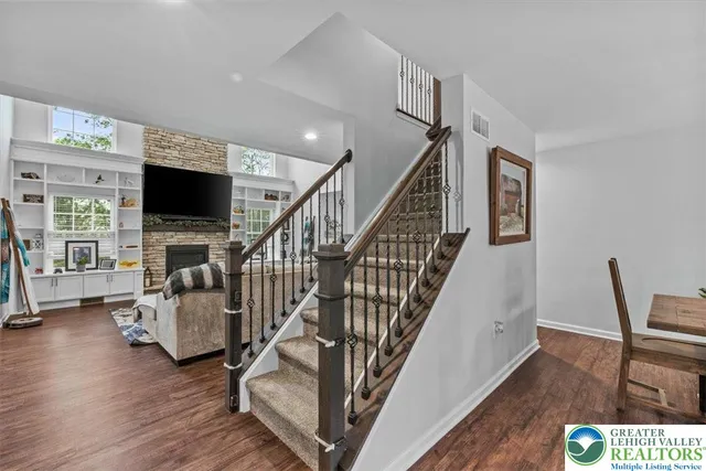 a dining room with furniture and wooden floor