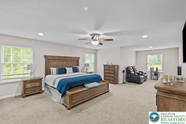 a bathroom with a bathtub a sink a toilet and shower