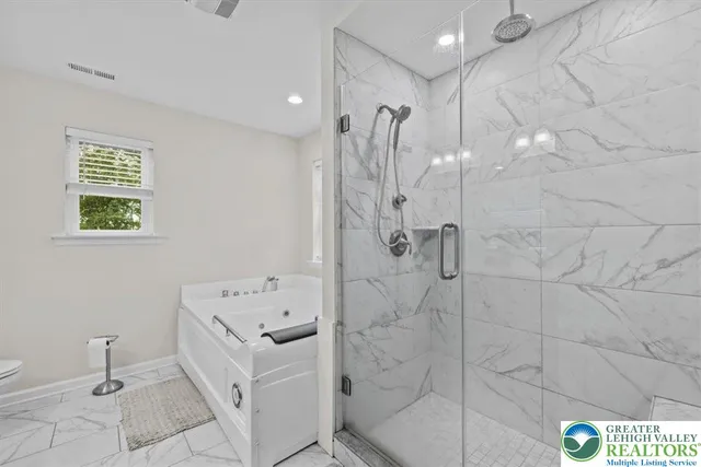 a bed room with two beds and a chandelier