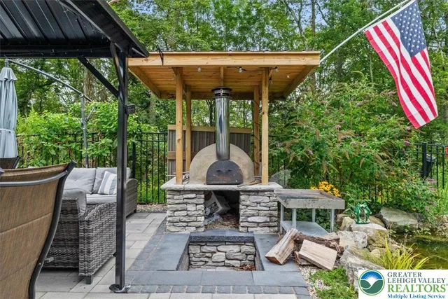 a view of a house with pool and chairs