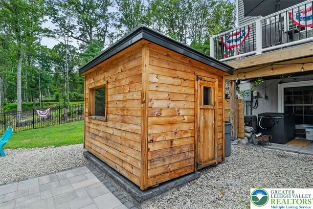 a view of a patio with chairs and a table