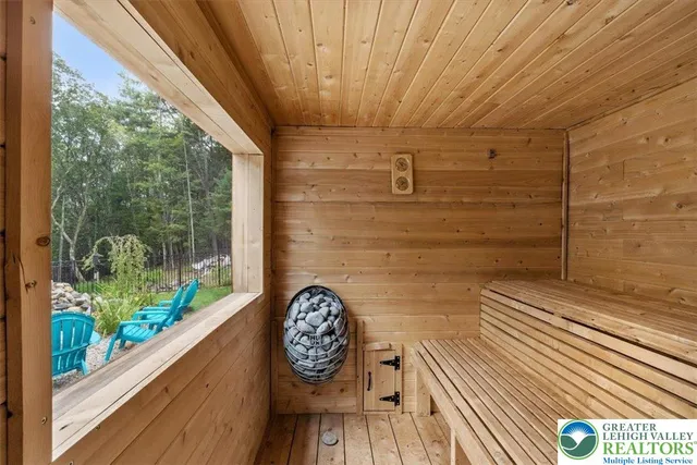 an aerial view of a house with garden space and street view