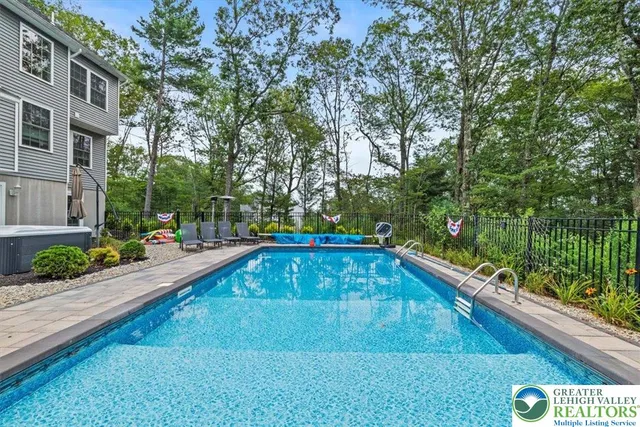 an aerial view of a house with garden space and street view