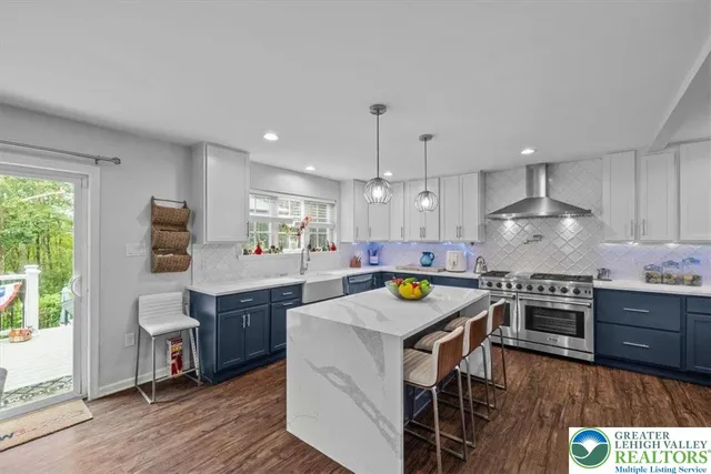 a kitchen with a stove a sink and a refrigerator