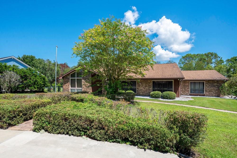 a front view of a house with garden