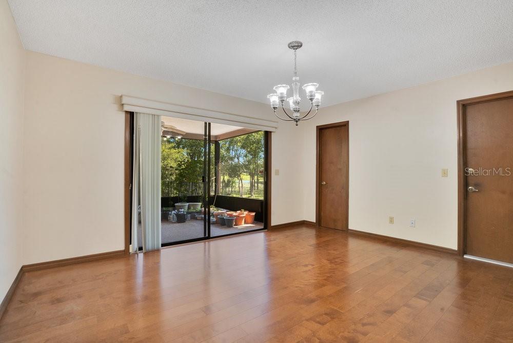 2088 Golden Arm Road Deltona, FL 32738 - Photo 12 of 51 wooden floor in an empty room with a window