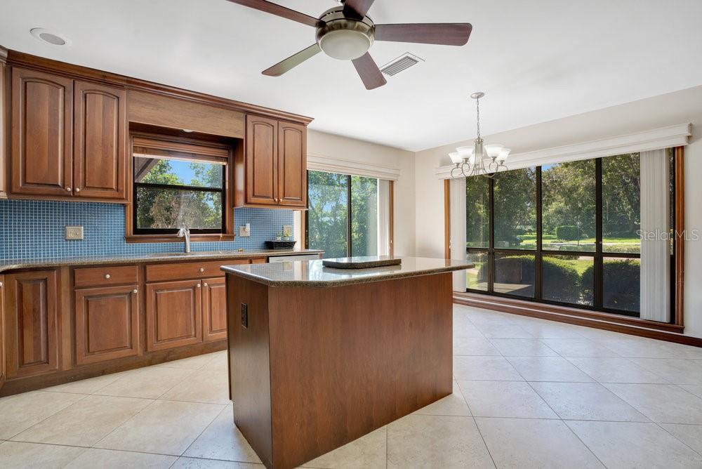 2088 Golden Arm Road Deltona, FL 32738 - Photo 19 of 51 a kitchen with stainless steel appliances granite countertop a stove a sink dishwasher and a microwave oven with cabinets