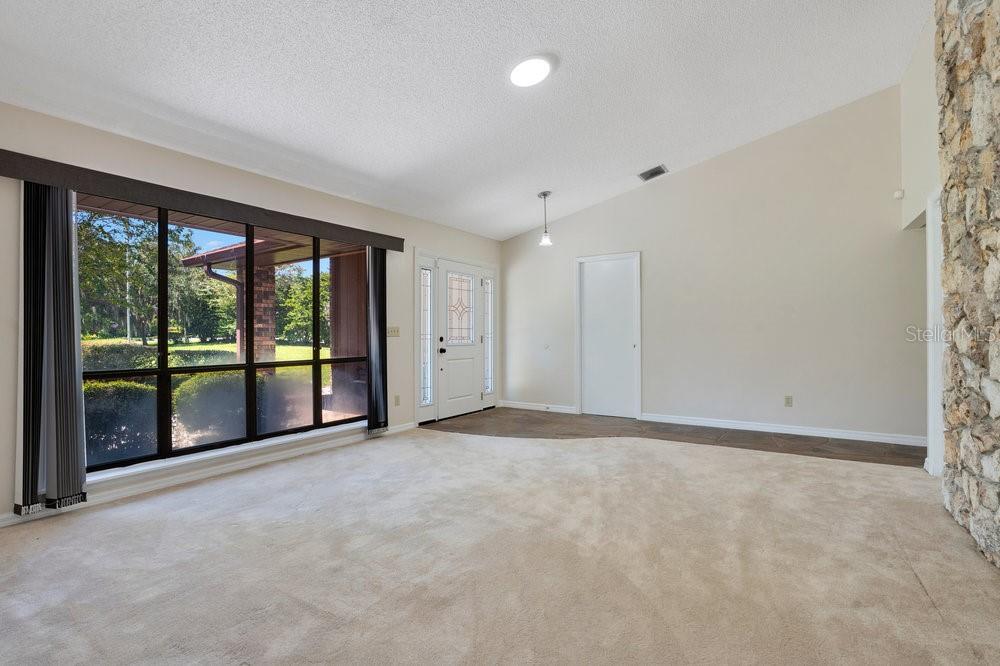 2088 Golden Arm Road Deltona, FL 32738 - Photo 21 of 51 a view of an empty room with a large window