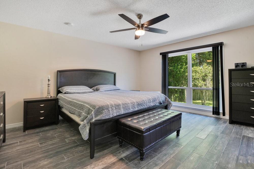 2088 Golden Arm Road Deltona, FL 32738 - Photo 25 of 51 a bedroom with a bed and a large window
