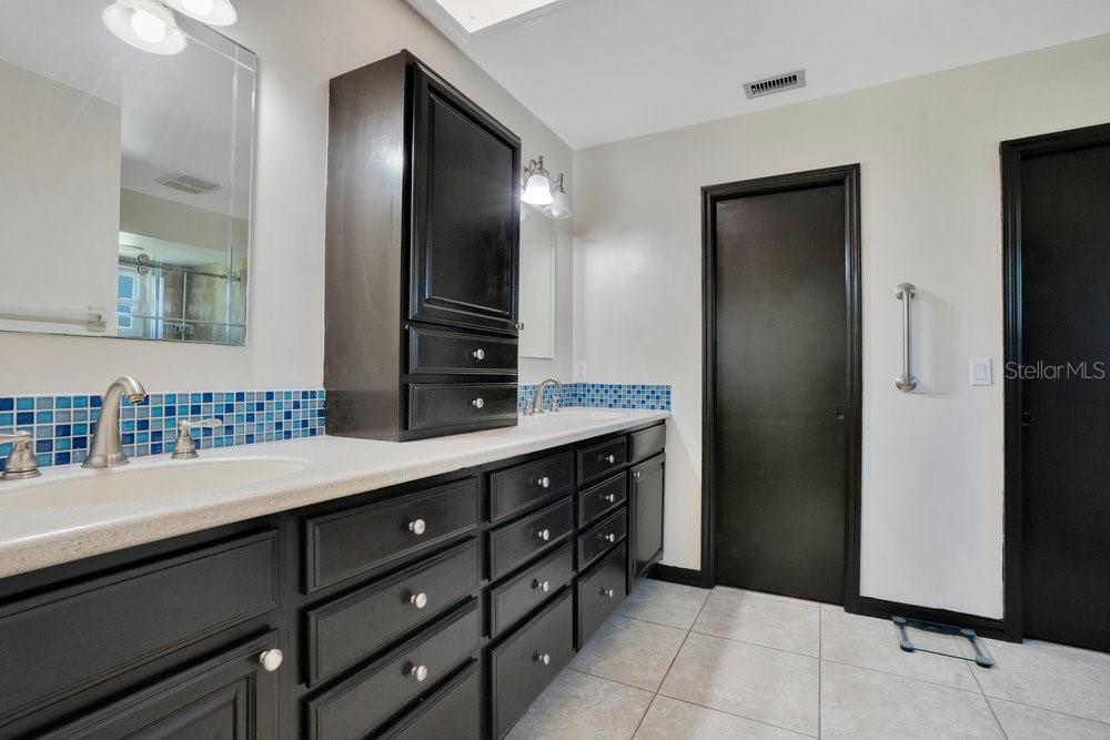 2088 Golden Arm Road Deltona, FL 32738 - Photo 27 of 51 a bathroom with a double vanity sink and a mirror