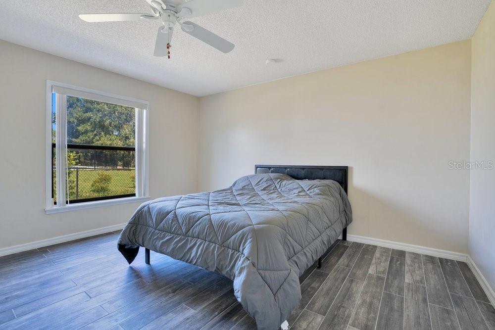 2088 Golden Arm Road Deltona, FL 32738 - Photo 28 of 51 a bedroom with a bed and a window