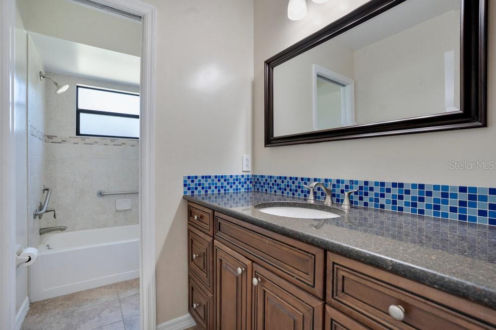 2088 Golden Arm Road Deltona, FL 32738 - Photo 29 of 51 a bathroom with a sink a vanity and a mirror
