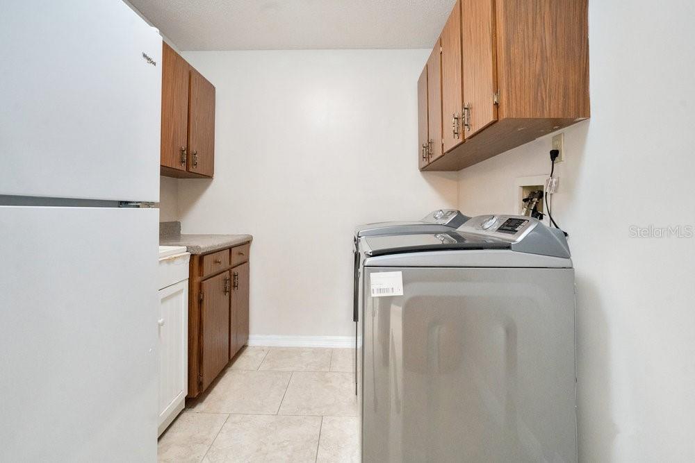 2088 Golden Arm Road Deltona, FL 32738 - Photo 30 of 51 a utility room with dryer and washer
