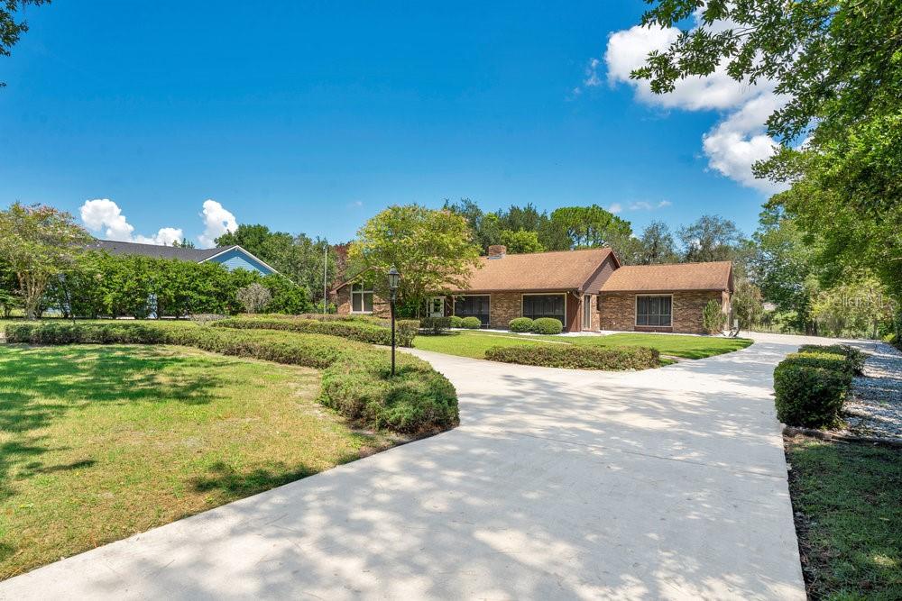 2088 Golden Arm Road Deltona, FL 32738 - Photo 3 of 51 a house view with a garden space
