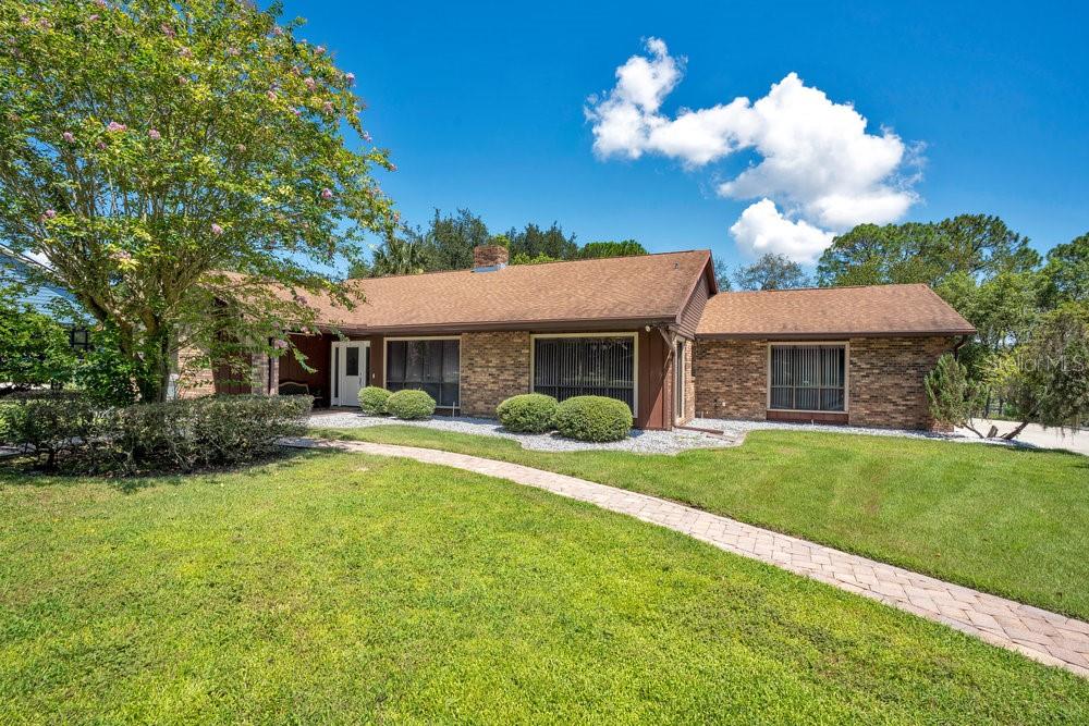 2088 Golden Arm Road Deltona, FL 32738 - Photo 4 of 51 a front view of a house with a yard