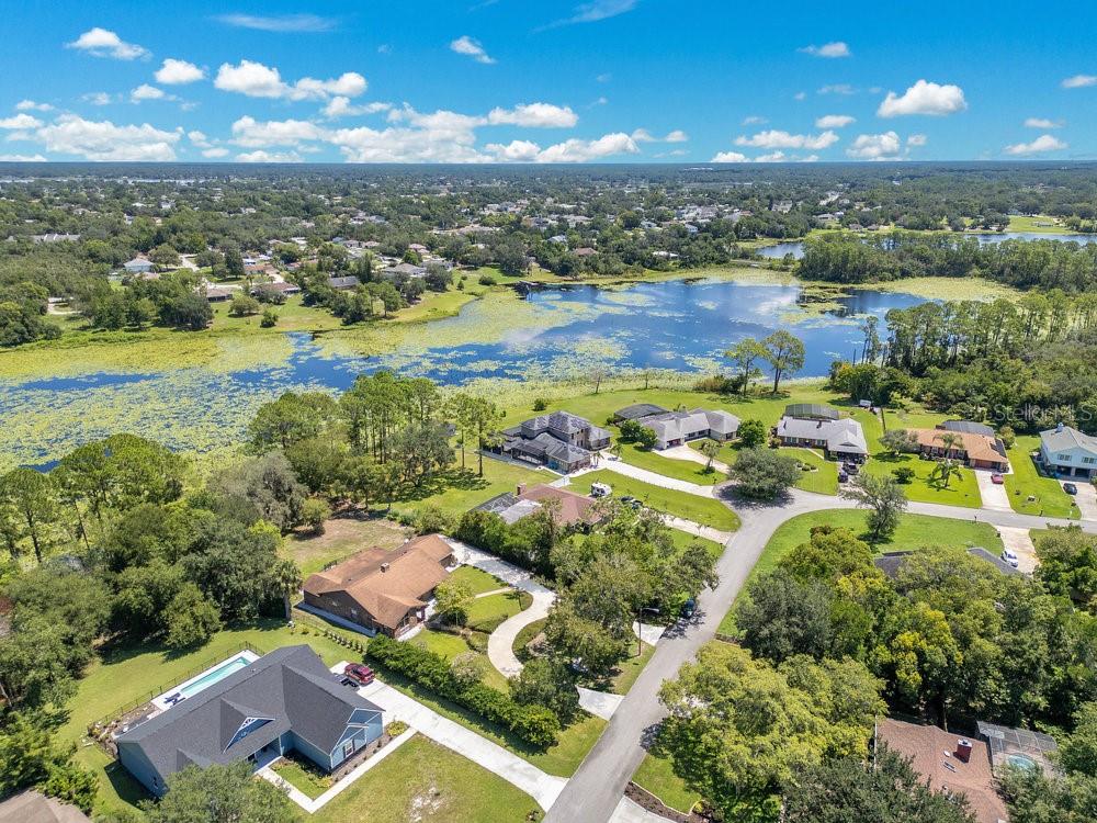 2088 Golden Arm Road Deltona, FL 32738 - Photo 45 of 51 an aerial view of residential houses with outdoor space and river