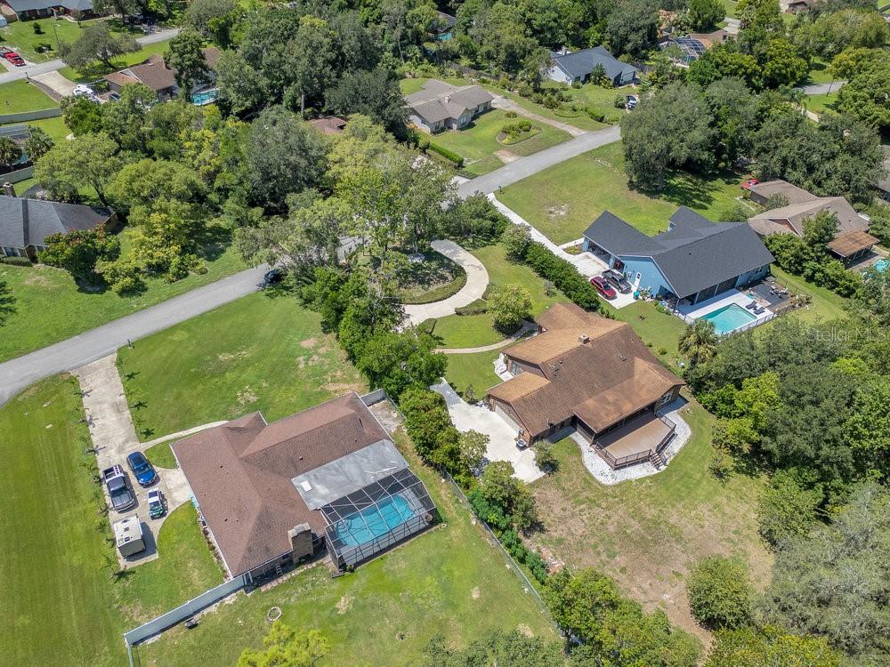 2088 Golden Arm Road Deltona, FL 32738 - Photo 50 of 51 an aerial view of a house with a garden