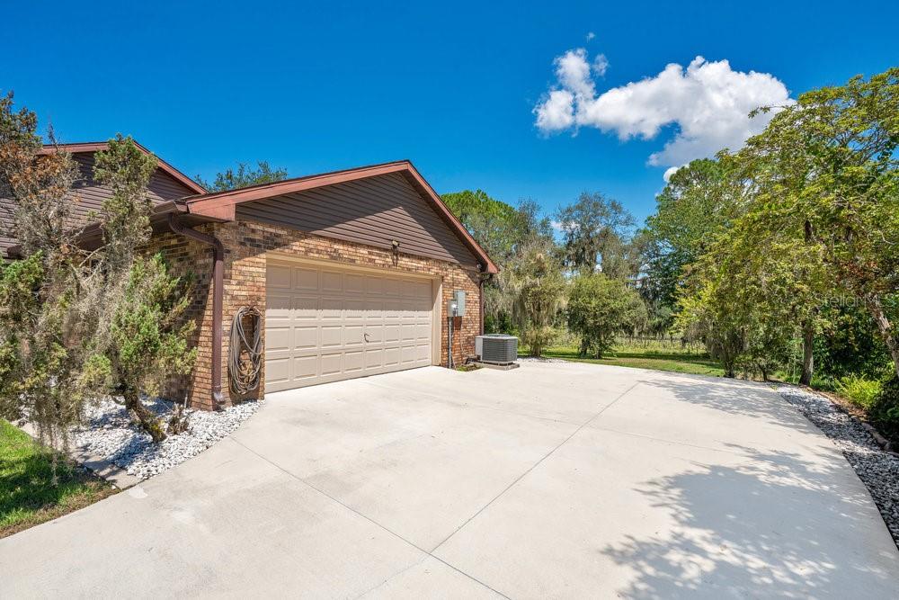 2088 Golden Arm Road Deltona, FL 32738 - Photo 6 of 51 a front view of a house with a yard and garage