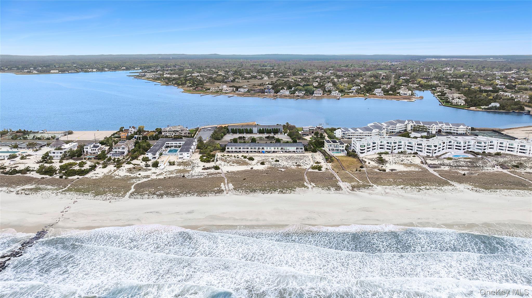 279 Dune Road, Unit 2 Westhampton Beach, NY 11978 - Photo 37 of 45 an aerial view of residential building and ocean