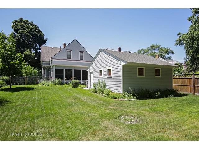 721 North Spring Street Elgin, IL 60120 - Photo 16 of 16 a front view of a house with a yard