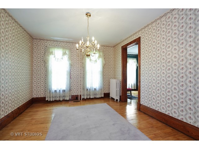 721 North Spring Street Elgin, IL 60120 - Photo 7 of 16 a view of an empty room with a window