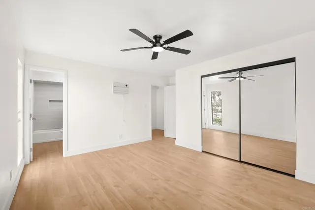 a bathroom with a sink vanity mirror and toilet