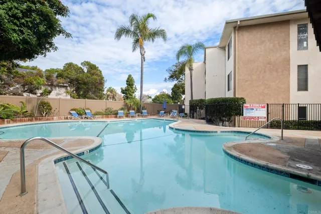 a view of a swimming pool with a lounge chairs