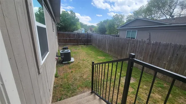 a view of a porch with a small yard