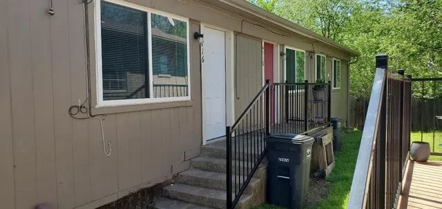 a view of balcony with wooden floor and outdoor seating