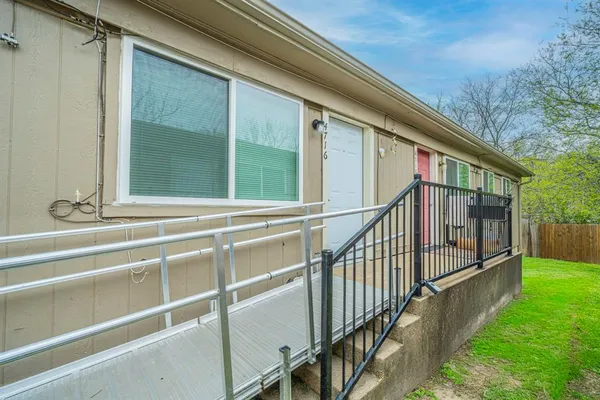 a view of backyard with deck and outdoor seating