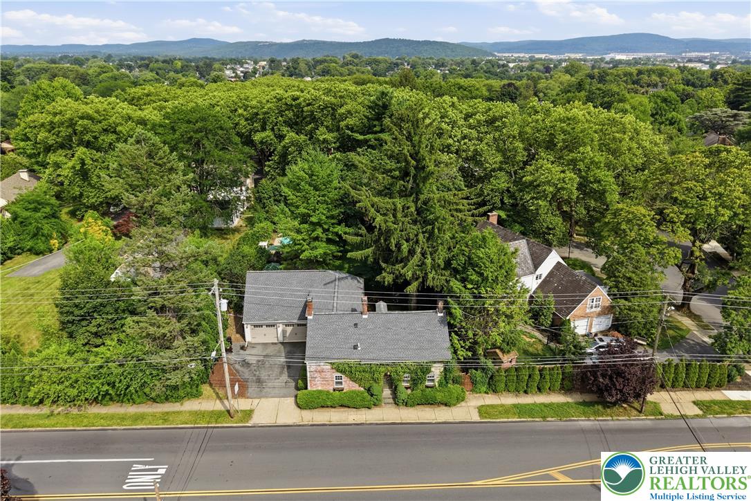 2014 Linden Street Bethlehem, PA 18017 - Photo 73 of 85 An aerial perspective reveals a charming residence nestled amidst a verdant landscape, showcasing its private yard and surrounding trees.