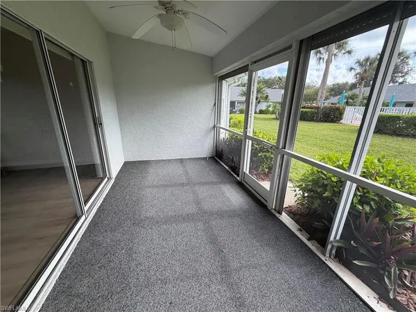 a view of an empty room with a large window