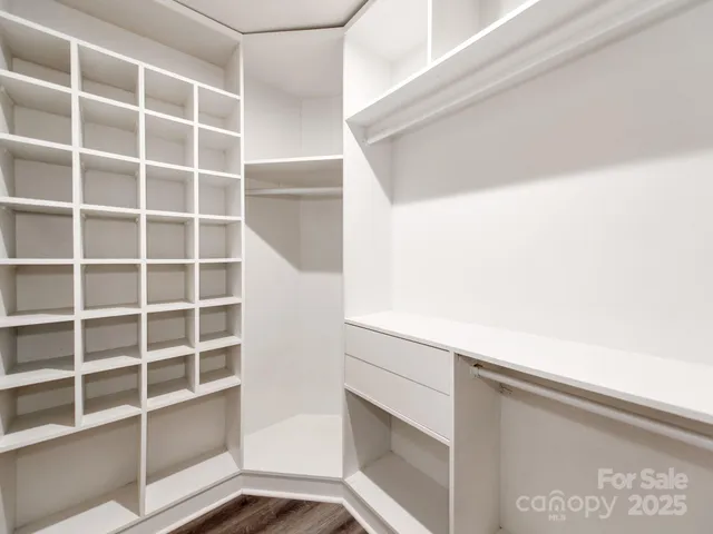 a bathroom with a toilet a sink and a window