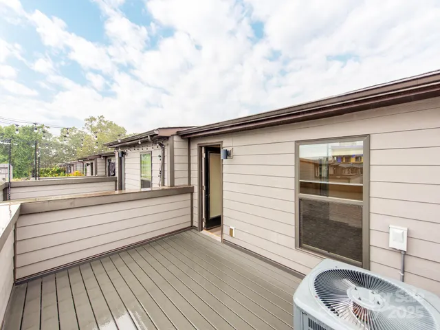 an empty room with windows and entryway