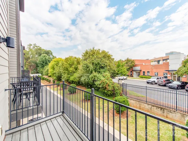 a view of a street from a balcony