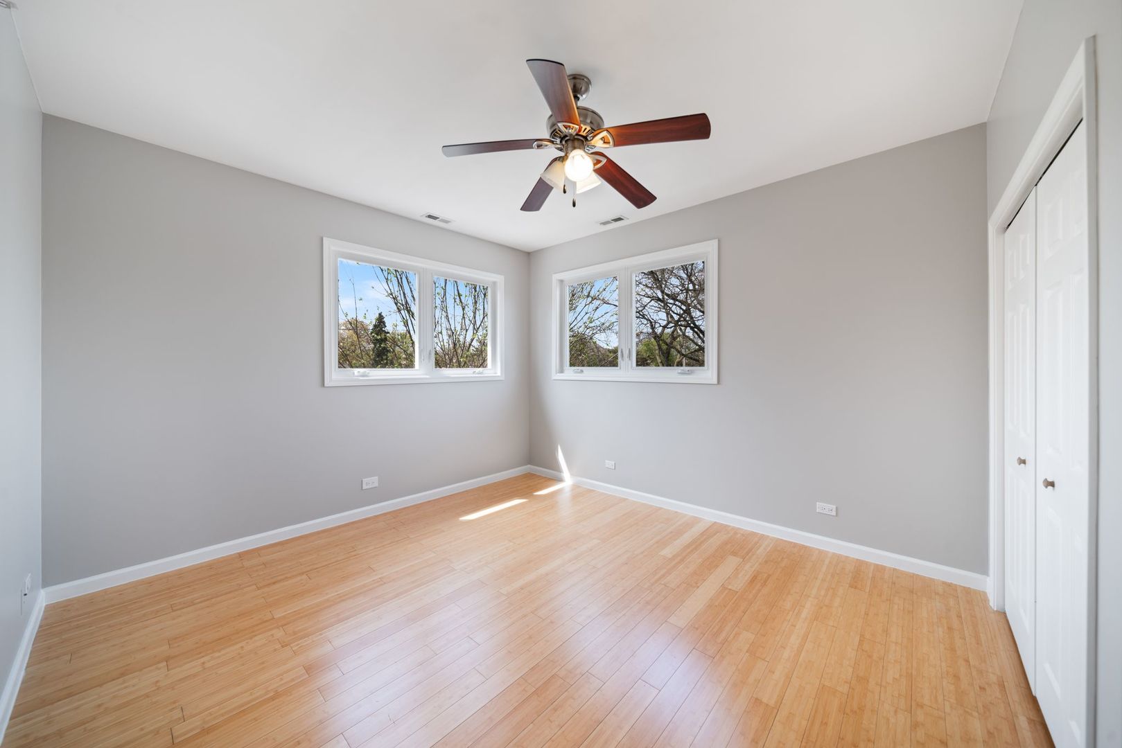 701 Oakton Street Park Ridge, IL 60068 - Photo 27 of 59 a view of empty room with wooden floor and fan