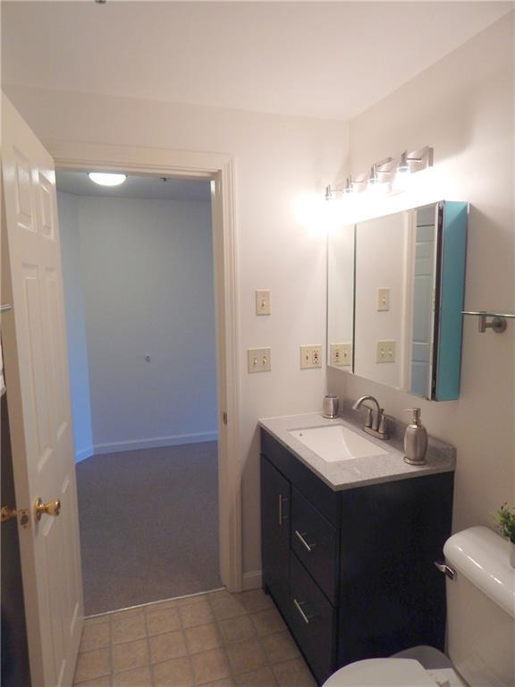 574 Main Street, Unit 102 Damariscotta, ME 04543 - Photo 11 of 27 New vanity, mirrors and fixtures set...