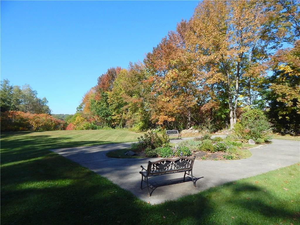 574 Main Street, Unit 102 Damariscotta, ME 04543 - Photo 3 of 27 Back lawn and garden area. Path that...