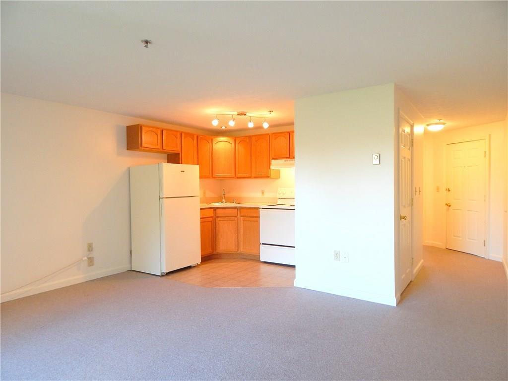 574 Main Street, Unit 102 Damariscotta, ME 04543 - Photo 5 of 27 Kitchen and living area looking down...