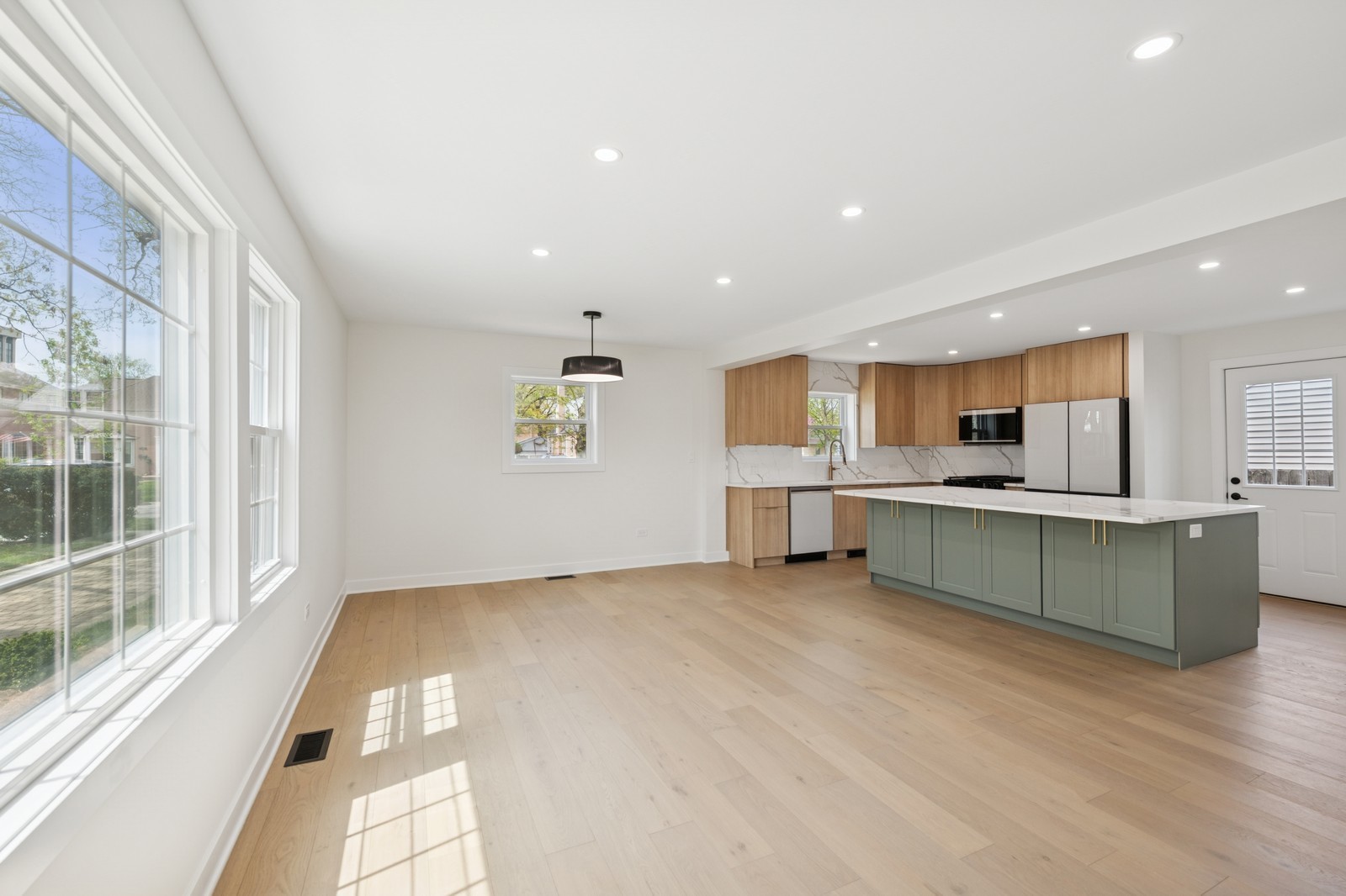 1929 South Ashland Avenue Park Ridge, IL 60068 - Photo 2 of 18 a view of kitchen with kitchen island a sink wooden floor and a large window