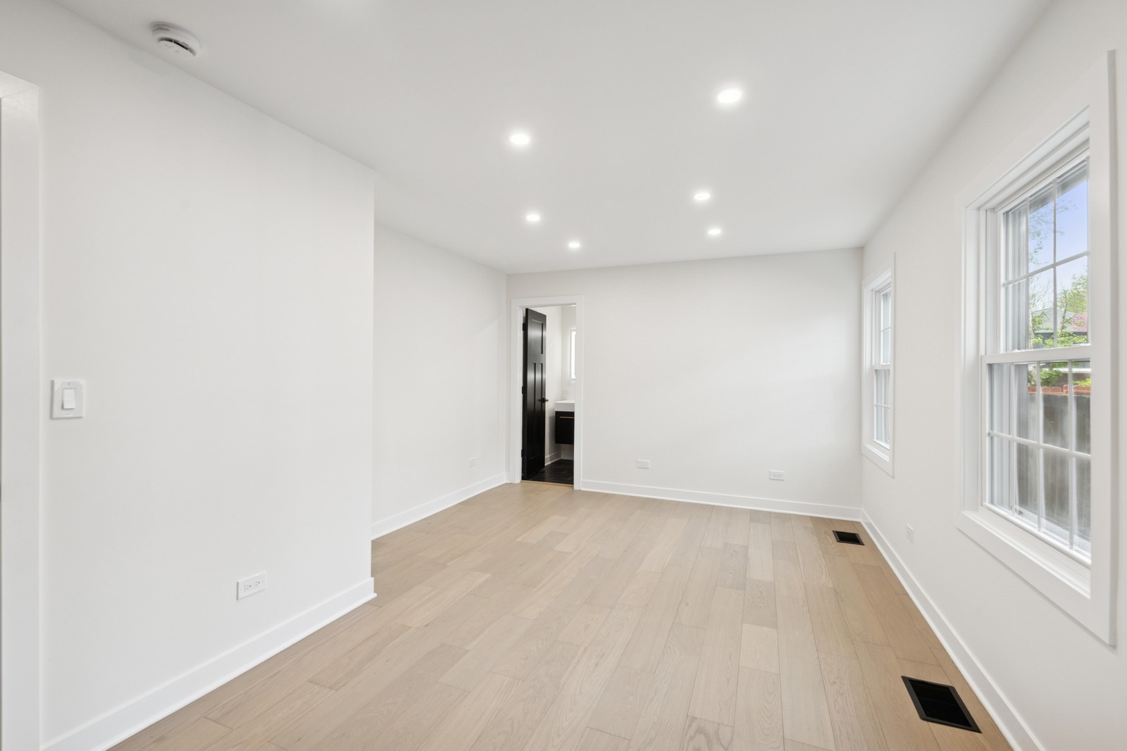 1929 South Ashland Avenue Park Ridge, IL 60068 - Photo 7 of 18 a view of an empty room with wooden floor and a window